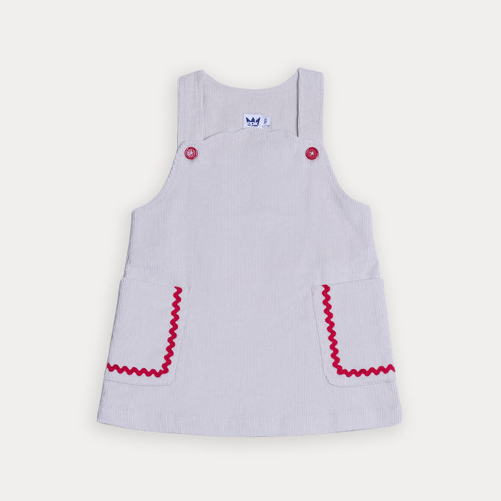 Vestido De Corduroy Arena Con Detalles En Rojo Para Bebe Niña