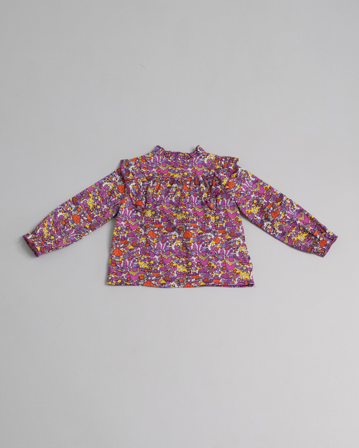 Blusa con estampado de hongos y volantes