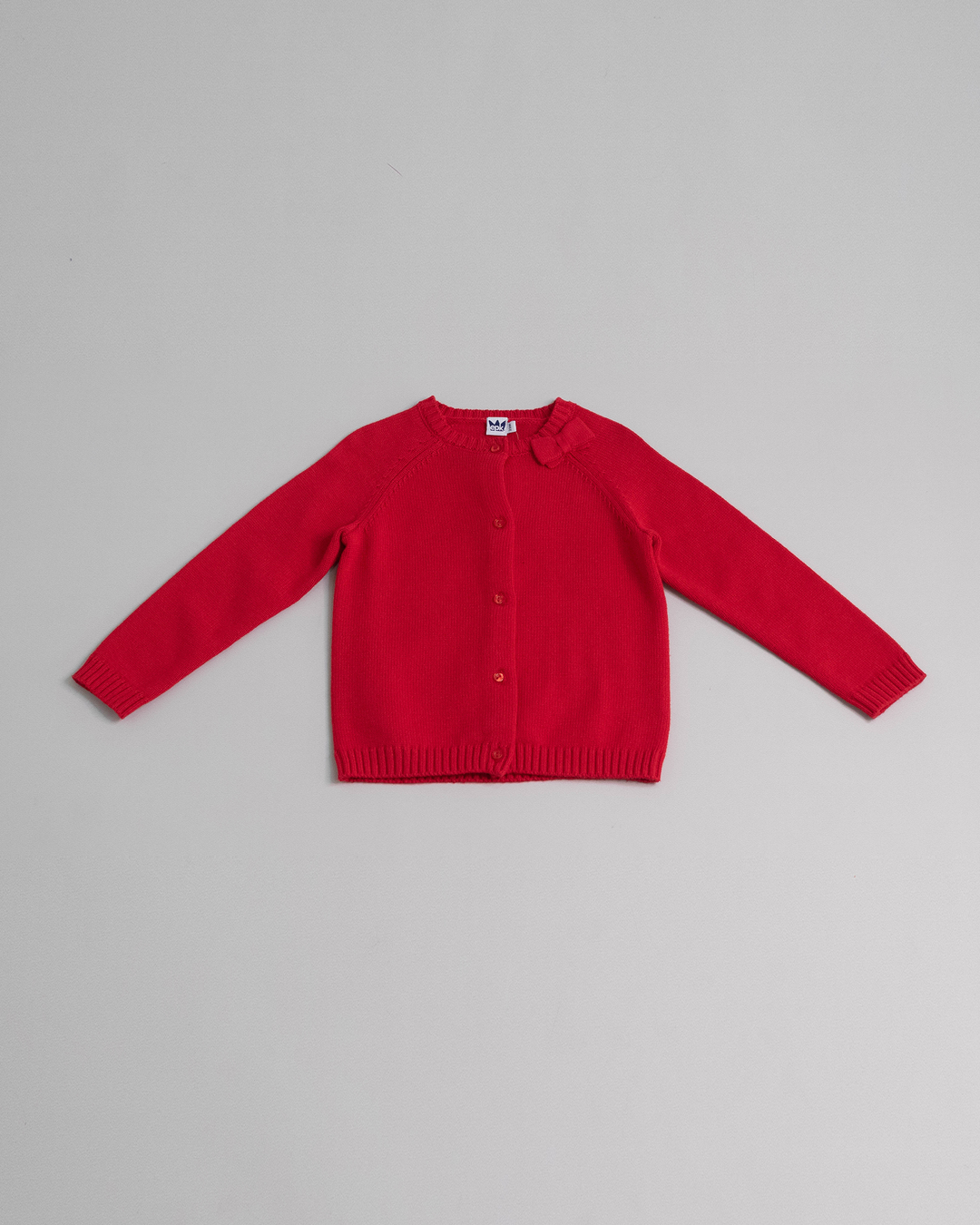 Cárdigan rojo de algodón con lazo y bolsillos