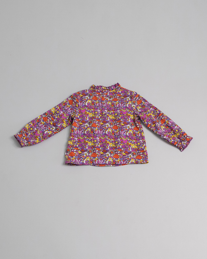 Blusa con estampado de hongos y volantes