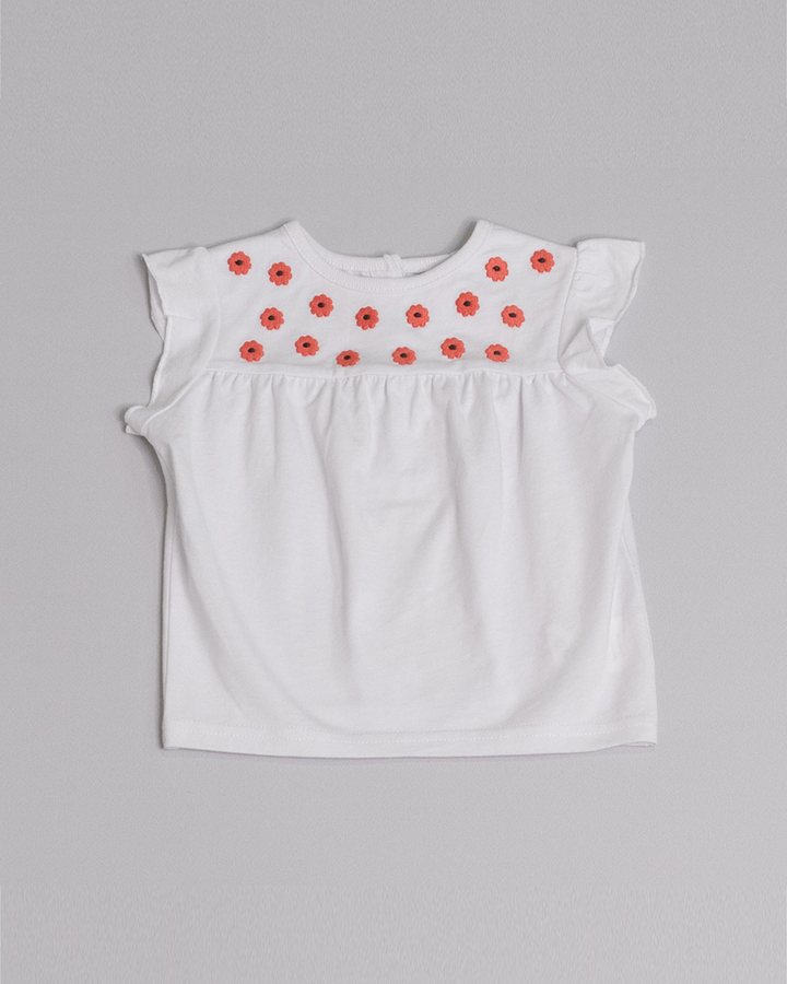Franela blanca con flores bordadas