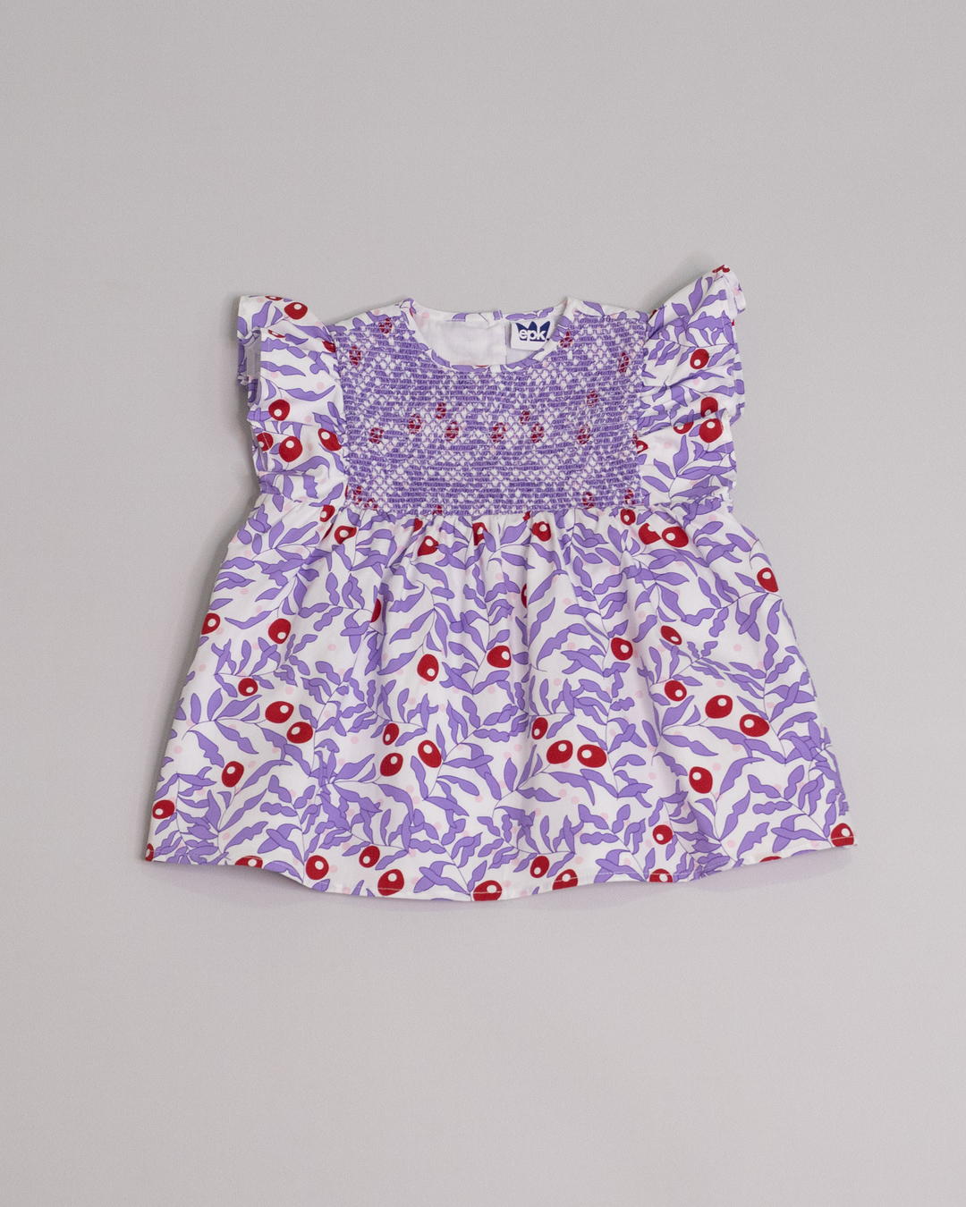 Blusa sin mangas de popelina con estampado morado y nido de abeja