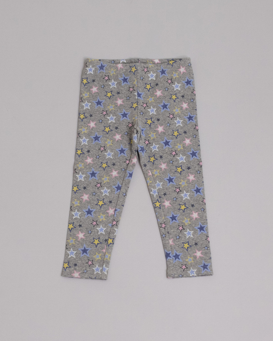 Legging gris con estampado de estrellas multicolor