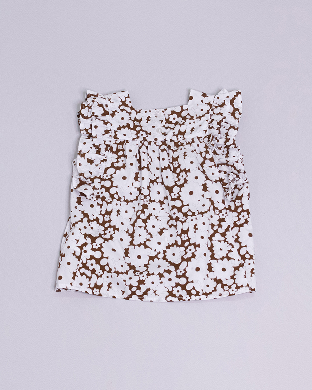 Blusa sin mangas con estampado blanco y marrón