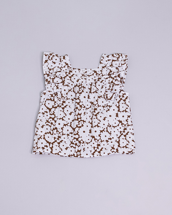 Blusa sin mangas estampada de color blanco y marrón