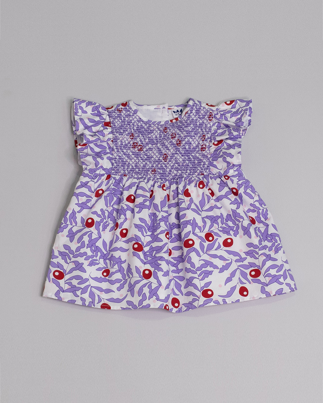 Blusa sin mangas de popelina con estampado morado y nido de abeja