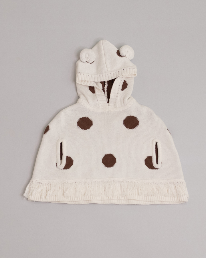 Poncho crema con círculos marrones