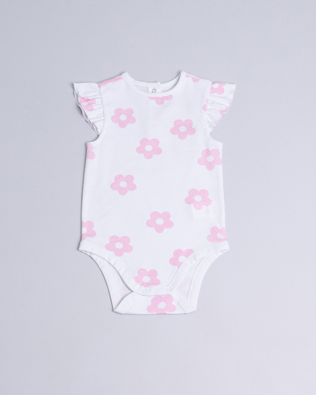 Body de color blanco con flores rosadas