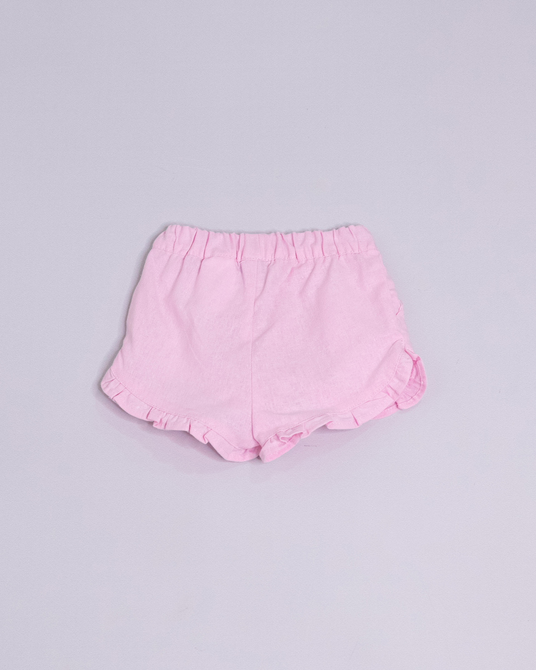 Short rosado con volantes