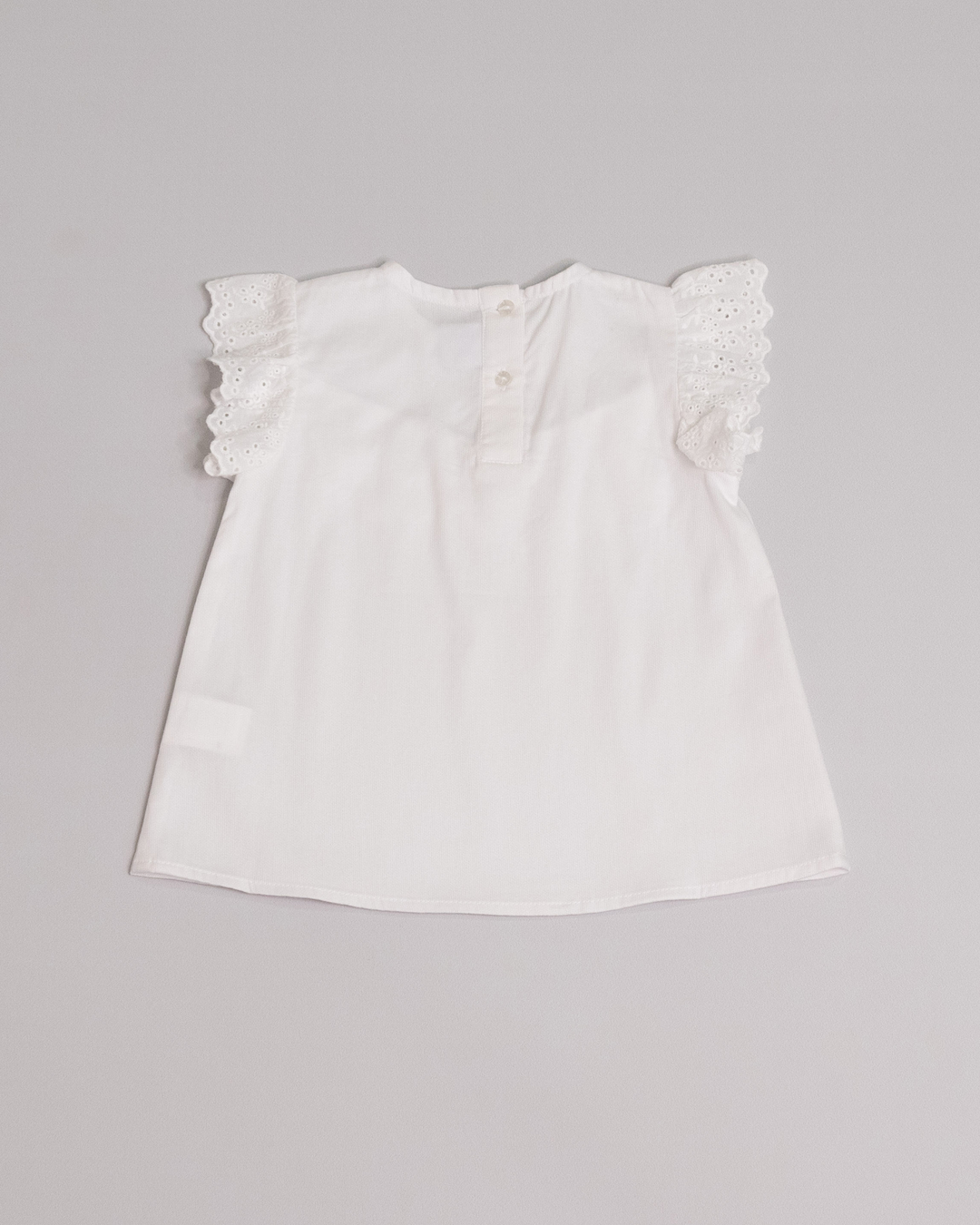 Franela sin mangas blanca con eyelet