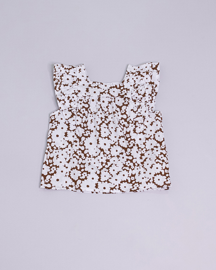 Blusa sin mangas estampada de color blanco y marrón